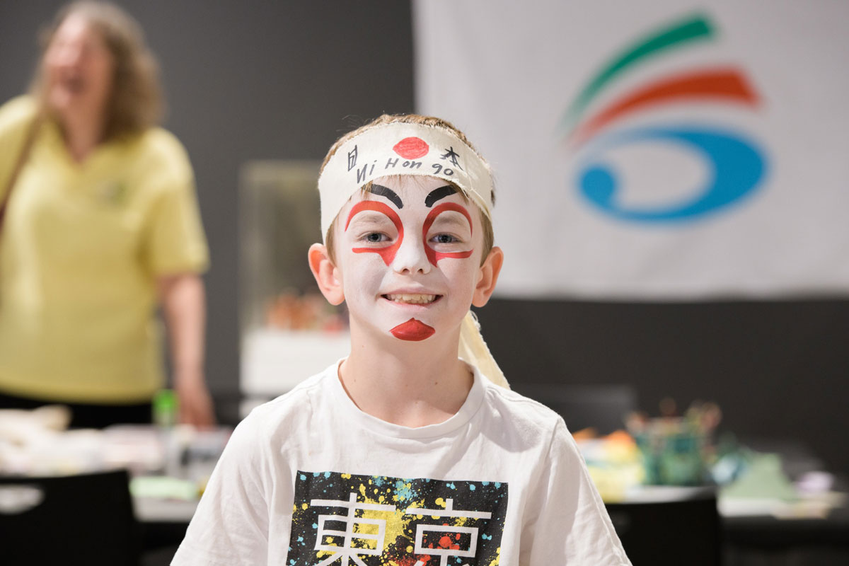 Young boy with face painted