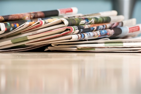 newspaper stack_shutterstock