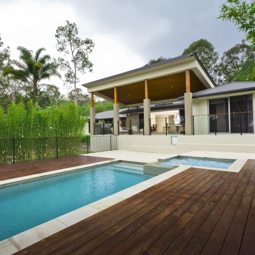 House with a pool and spa and fences
